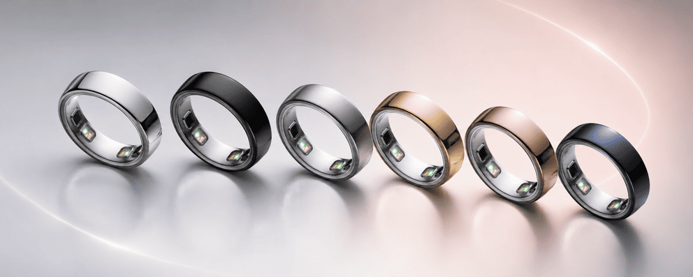 Six metallic rings with small internal LEDs, arranged in a row from silver to dark blue on a glossy surface.